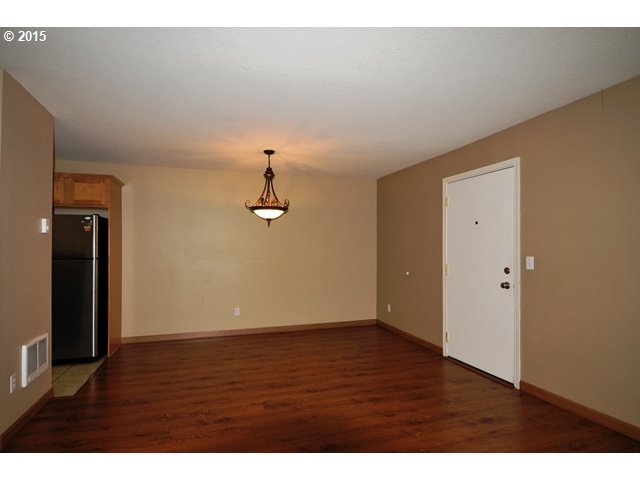 13320 Southwest Allen Boulevard, Unit 310 Beaverton, OR 97005 - Photo 5 of 18 a view of a room with wooden floor