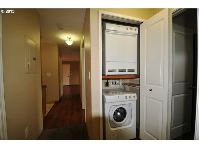 13320 Southwest Allen Boulevard, Unit 310 Beaverton, OR 97005 - Photo 9 of 18 a view of a hallway with washer and dryer