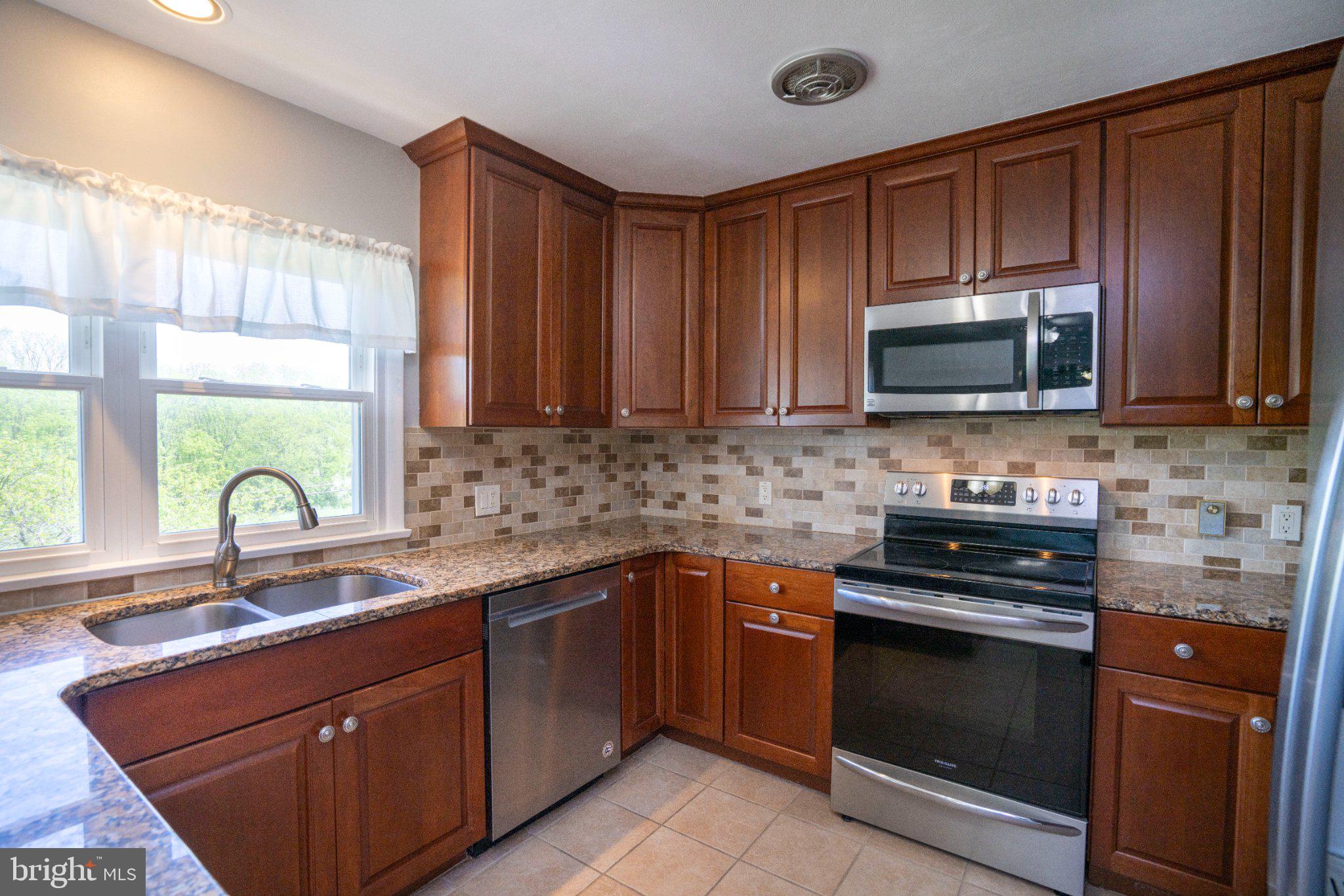 1639 Houserville Road State College, PA 16801 - Photo 22 of 54 Modern kitchen with rich wood accents.