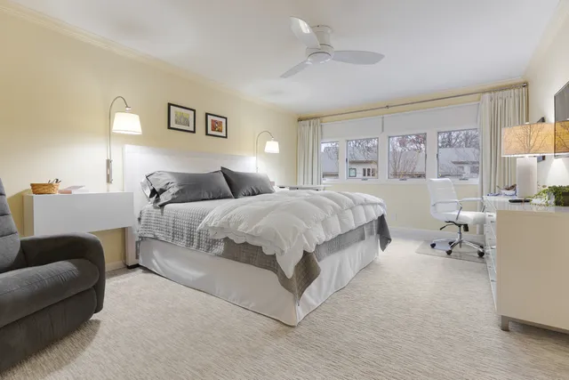 a spacious bedroom with a bed and a couch