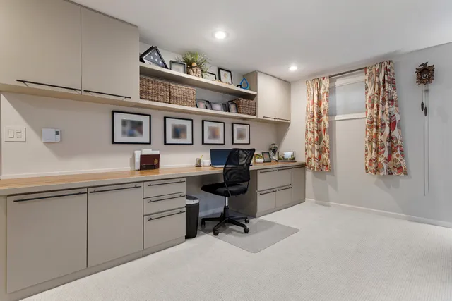 a view of a workspace with furniture