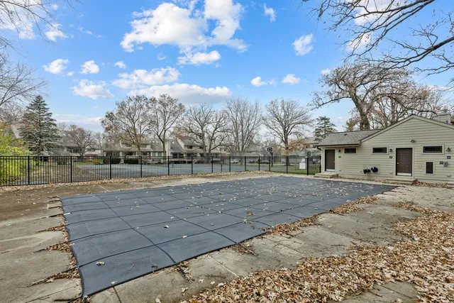 a view of dirt yard with large tree