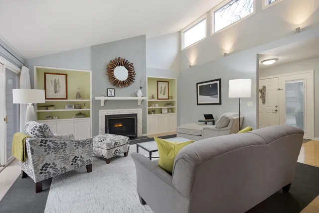 a living room with furniture and a fireplace