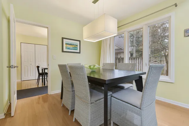 a view of a dining room with furniture and window