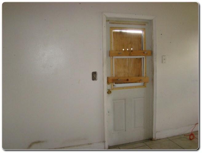 2581 Gulfstream Road Palm Springs, FL 33406 - Photo 6 of 25 BOARDED DOOR