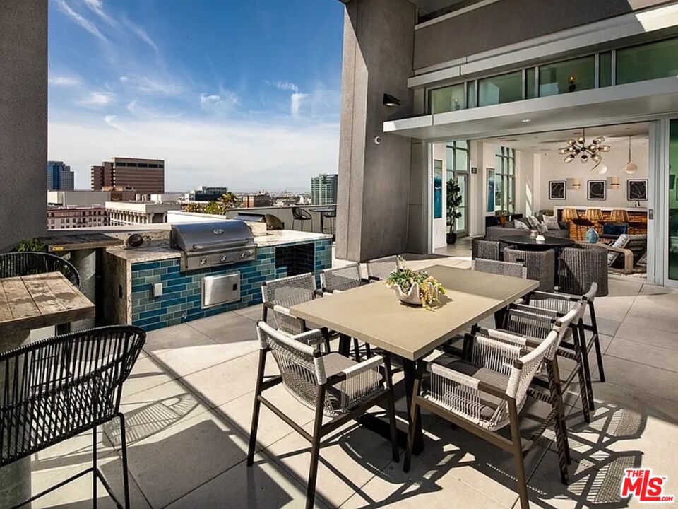 707 East Ocean Boulevard, Unit 1008 Long Beach, CA 90802 - Photo 8 of 21 a view of a patio with table and chairs