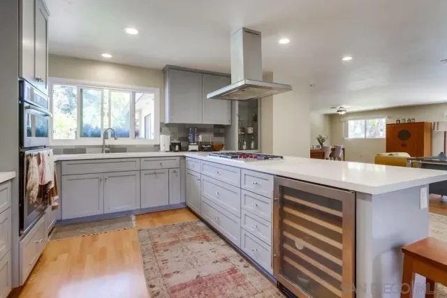 a kitchen with a sink cabinets and window