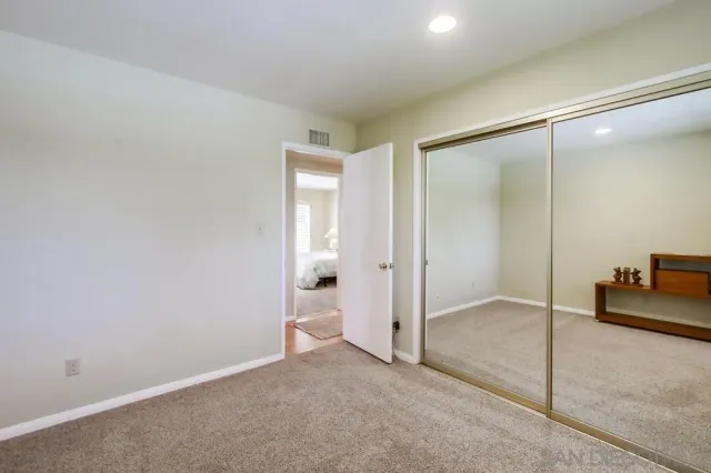 an empty room with mirror