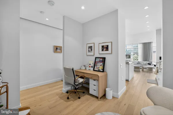 a view of a workspace with furniture and a livingroom