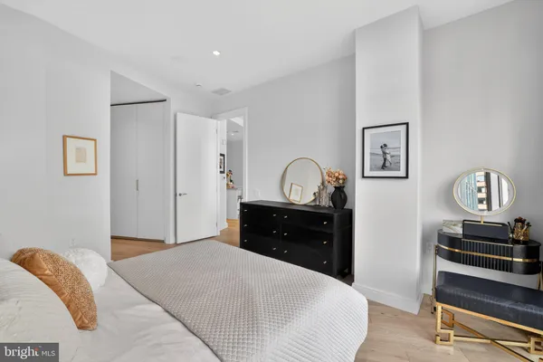 a bedroom with a bed and a dresser
