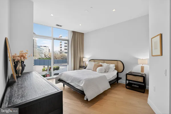 a bedroom with a bed and a table