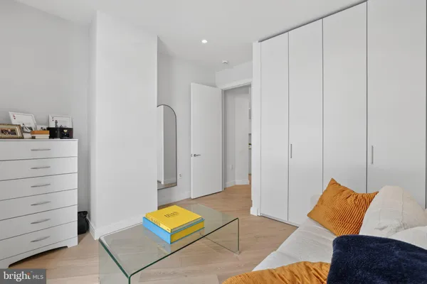 a view of room with furniture and wooden floor