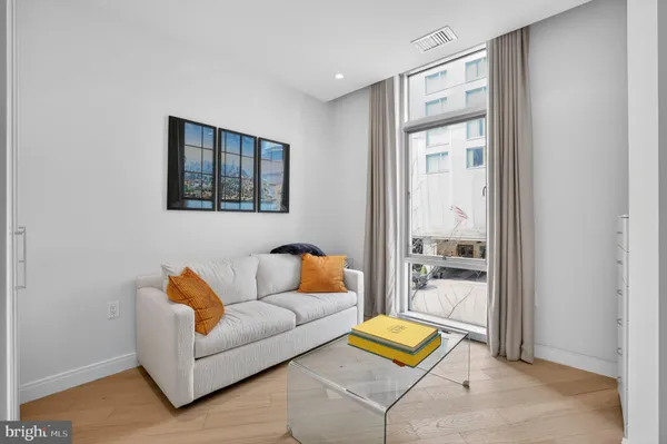 a living room with furniture and a rug