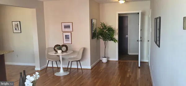 a view of a livingroom with furniture and wooden floor