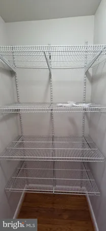 a view of a room with racks on the wall