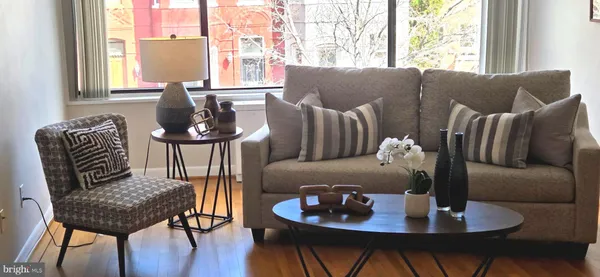 a living room with furniture and a window