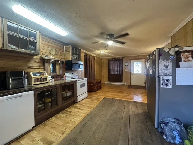 a kitchen with stainless steel appliances granite countertop a stove and a microwave