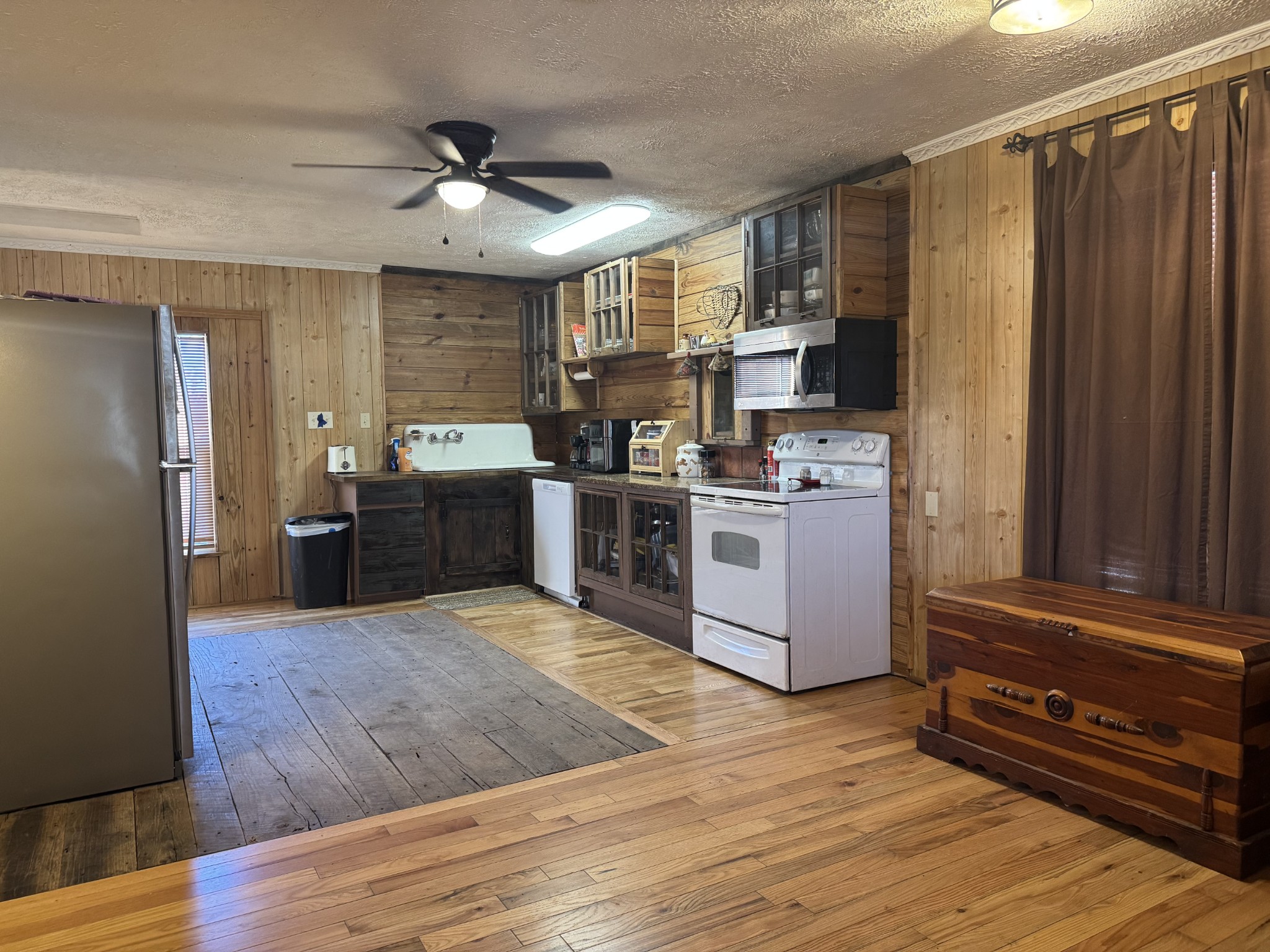 10795 Back Piney Road Bon Aqua, TN 37025 - Photo 18 of 64 a kitchen with stainless steel appliances granite countertop a stove top oven and refrigerator