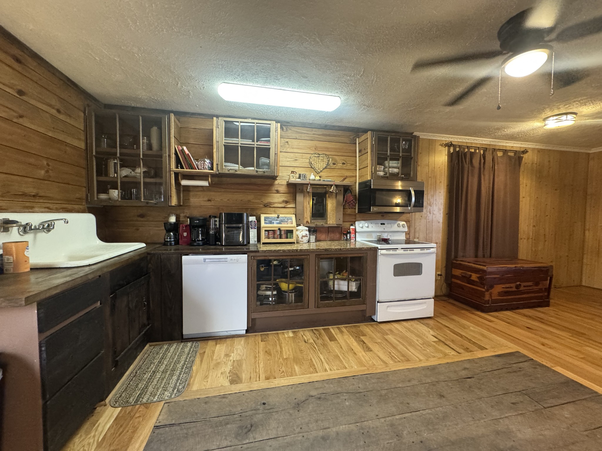 10795 Back Piney Road Bon Aqua, TN 37025 - Photo 24 of 64 a kitchen with stainless steel appliances granite countertop a stove a sink and a refrigerator
