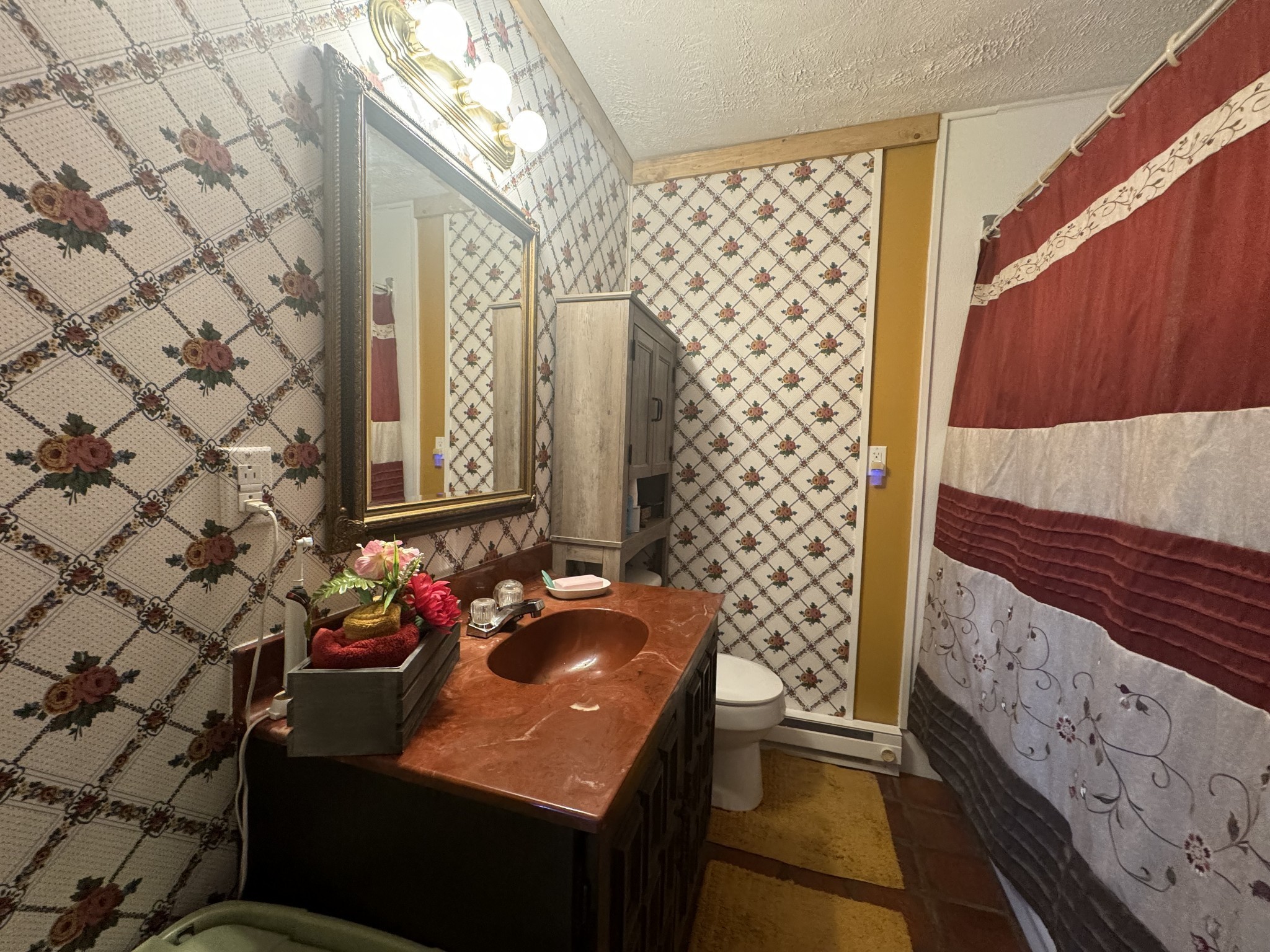 10795 Back Piney Road Bon Aqua, TN 37025 - Photo 26 of 64 a bathroom with a sink and a mirror
