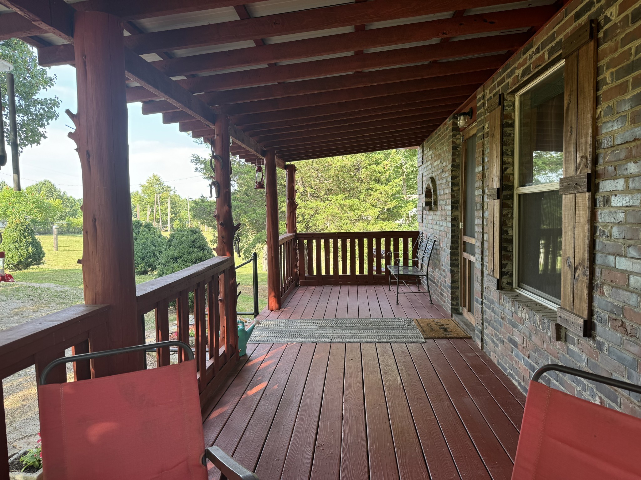 10795 Back Piney Road Bon Aqua, TN 37025 - Photo 3 of 64 a view of a balcony with wooden floor