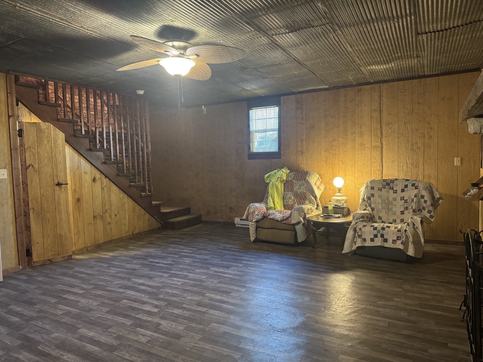 10795 Back Piney Road Bon Aqua, TN 37025 - Photo 40 of 64 a living room with furniture and a wooden floor
