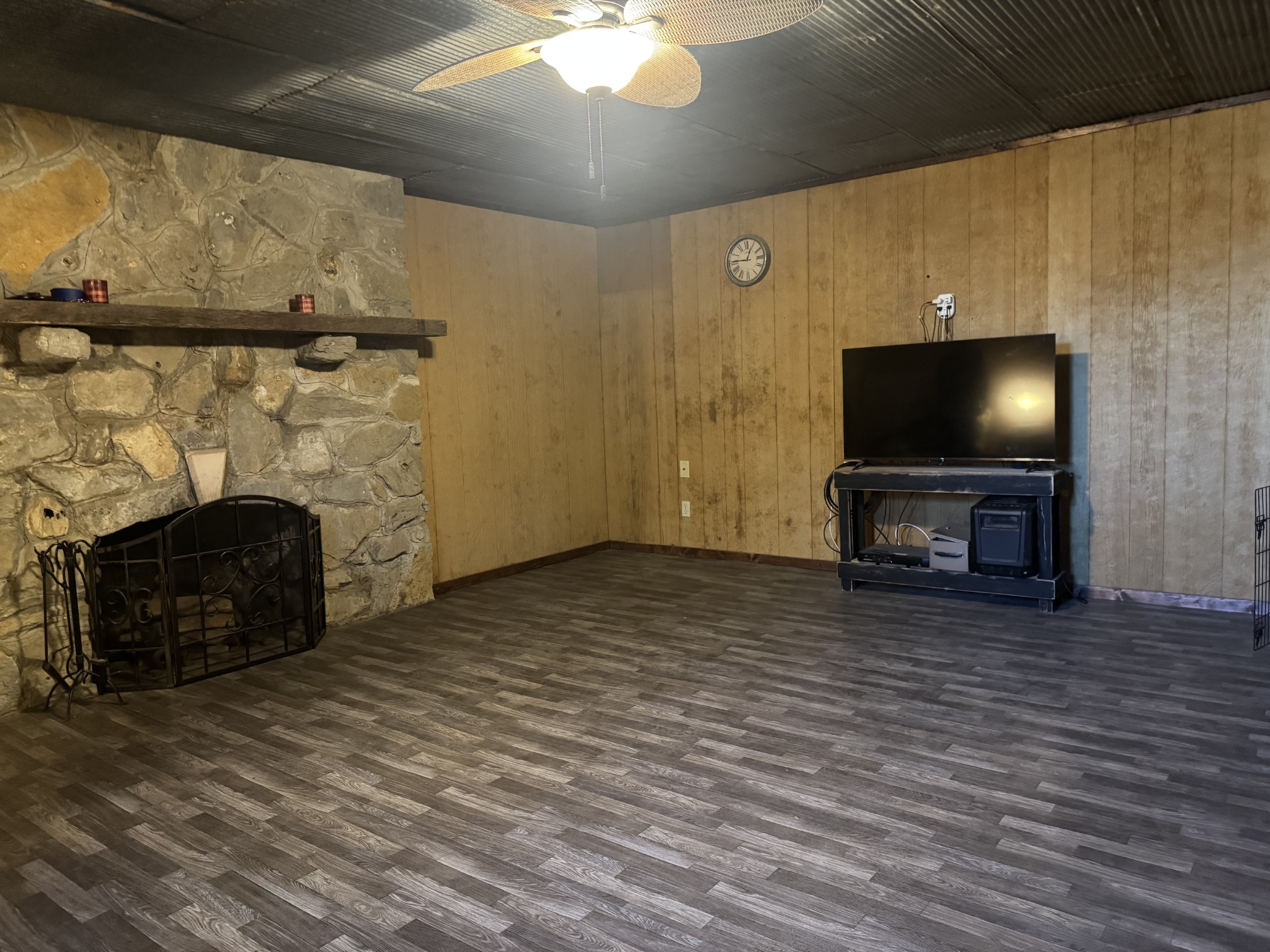 10795 Back Piney Road Bon Aqua, TN 37025 - Photo 41 of 64 a living room with furniture and a fireplace