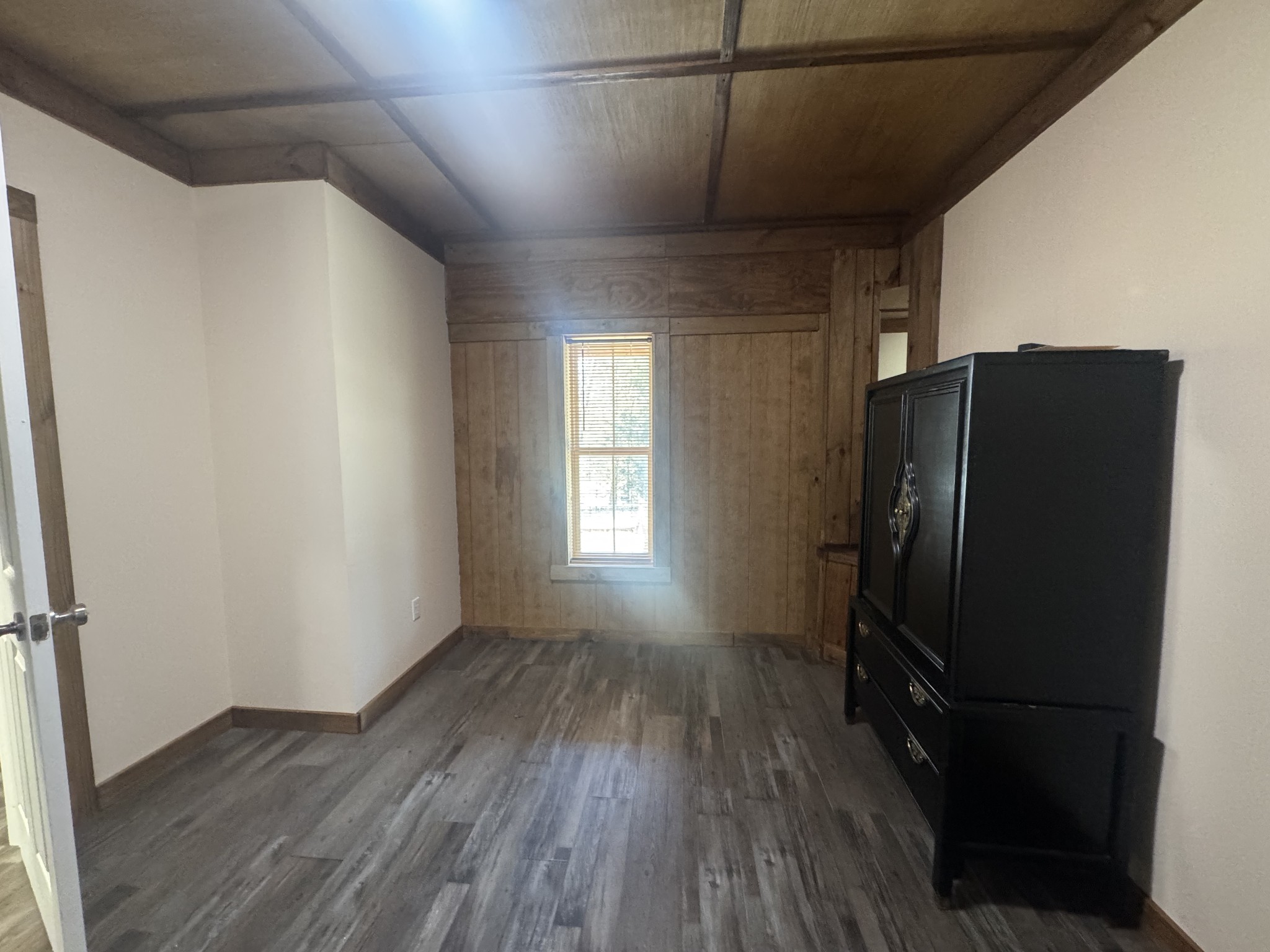 10795 Back Piney Road Bon Aqua, TN 37025 - Photo 50 of 64 a view of a refrigerator in kitchen and wooden floor