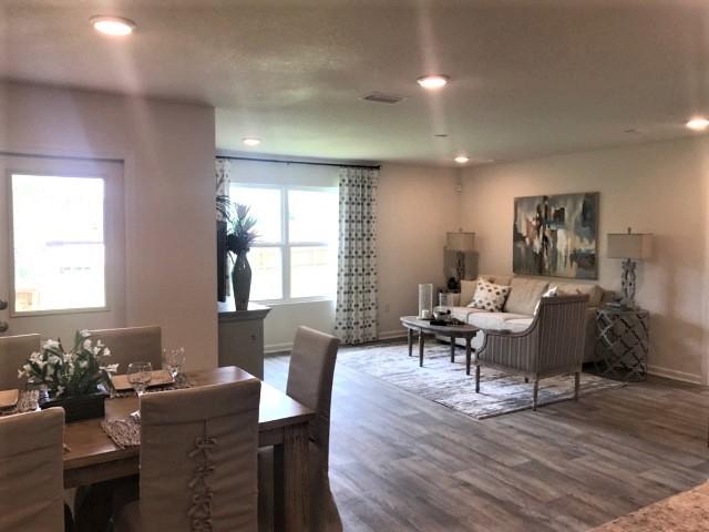 3582 Sugar Maple Lane Crestview, FL 32539 - Photo 6 of 20 a living room with furniture a wooden floor and a window
