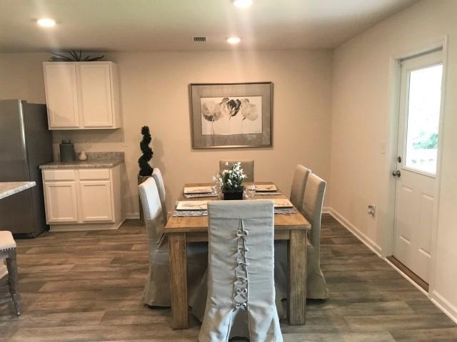 3582 Sugar Maple Lane Crestview, FL 32539 - Photo 7 of 20 a dining room with furniture and wooden floor