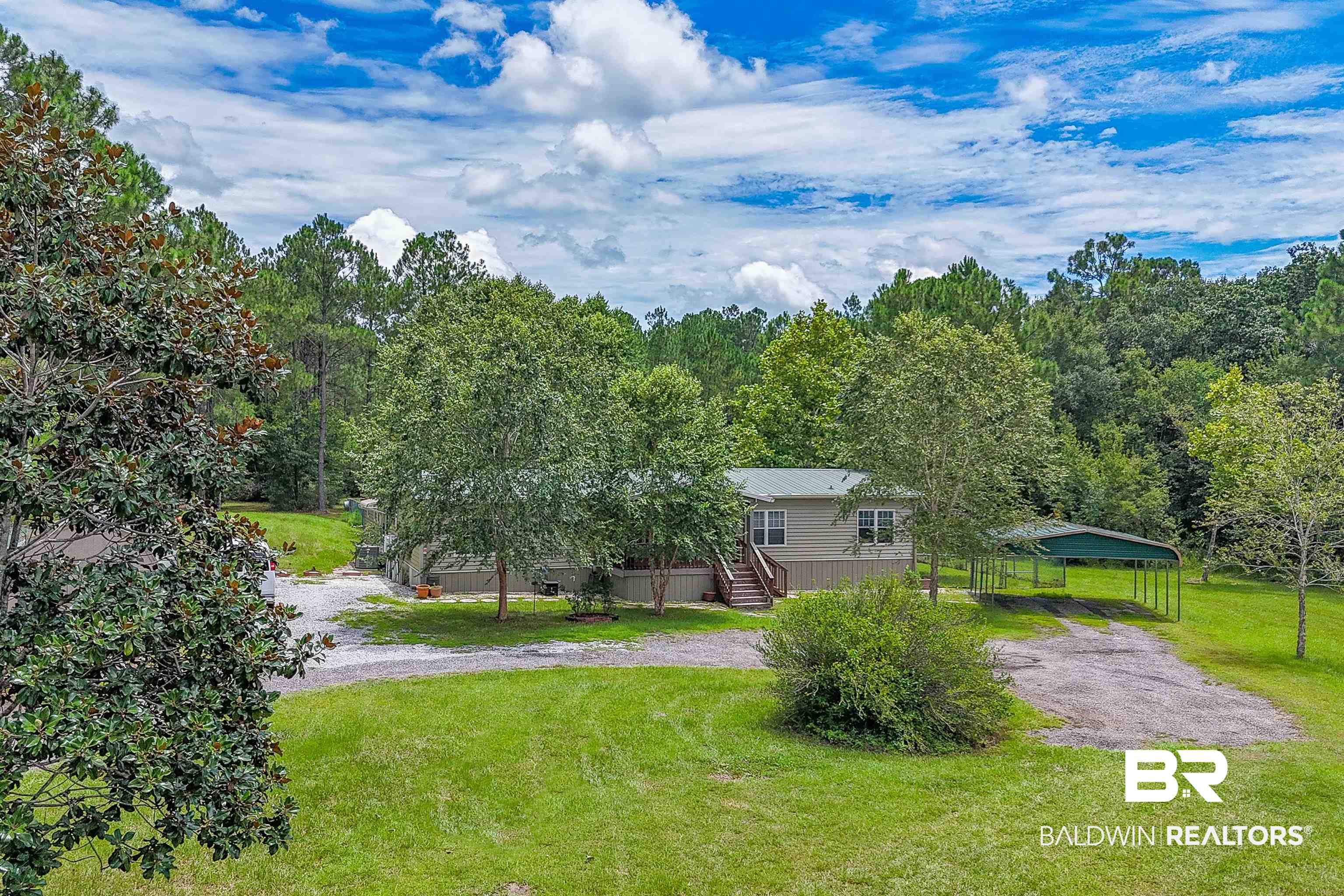 10970 Stucki Road Elberta, AL 36530 - Photo 41 of 56 View of yard with a carport