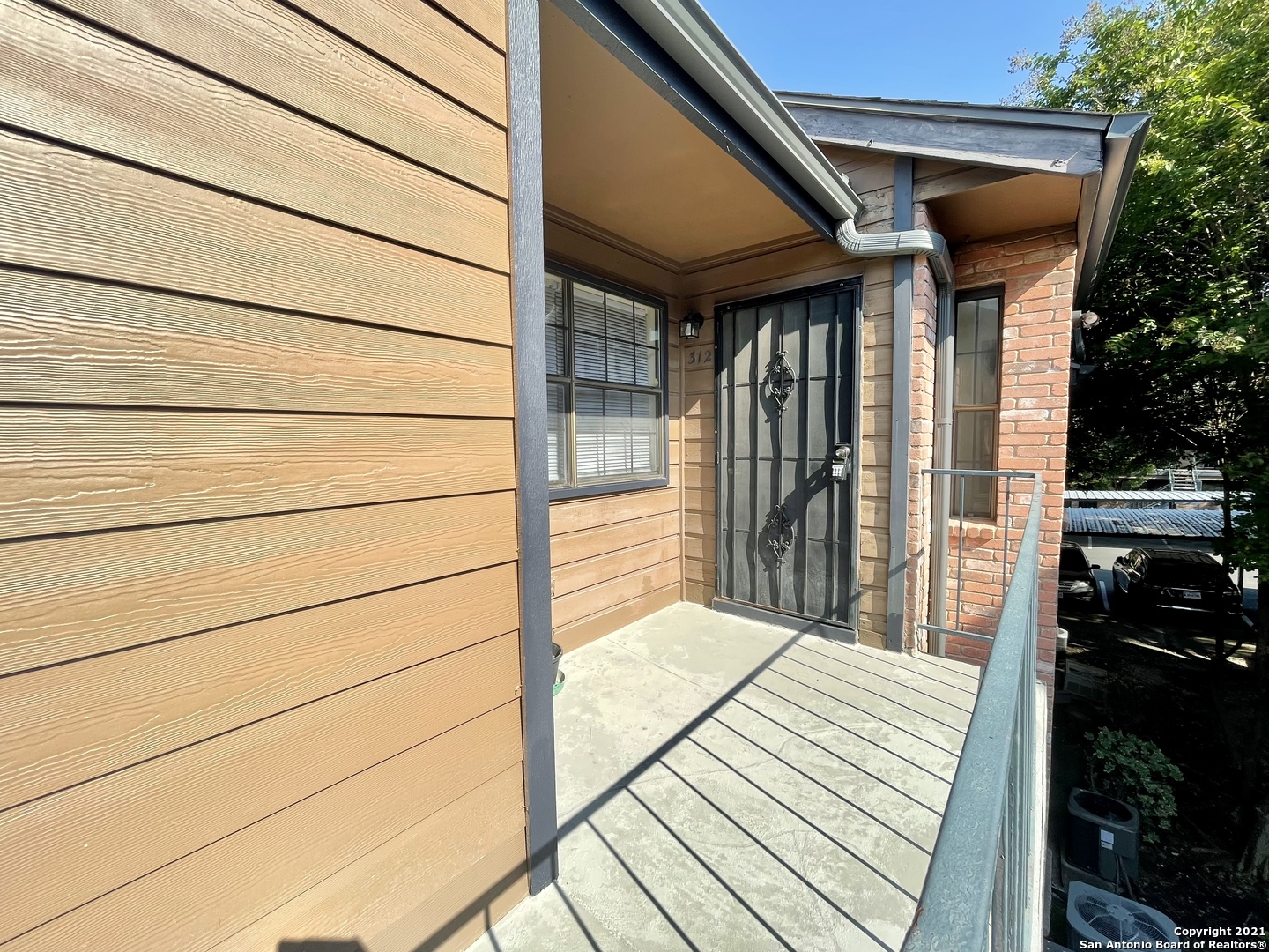 4803 Hamilton Wolfe Road, Unit 312 San Antonio, TX 78229 - Photo 2 of 13 a view of a balcony with wooden floor