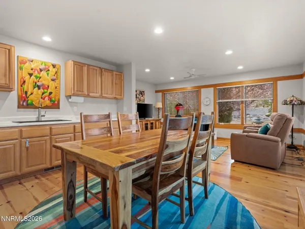 a view of a dining room with furniture window and wooden floor