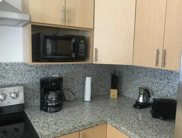 a kitchen with a stove and a microwave