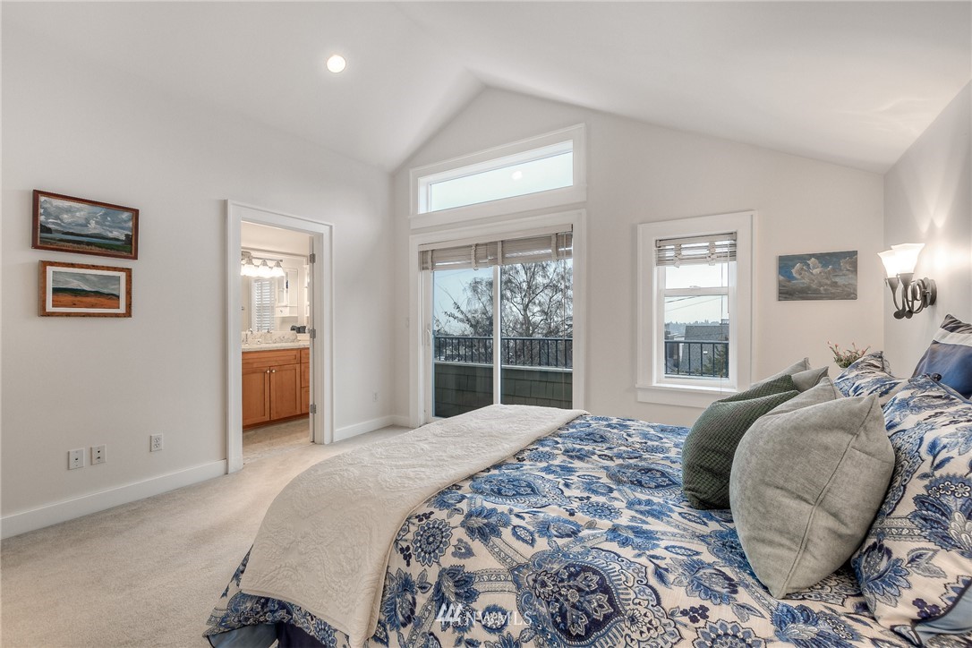 1940 9th Avenue West Seattle, WA 98119 - Photo 18 of 25 a bedroom with a large bed and a window