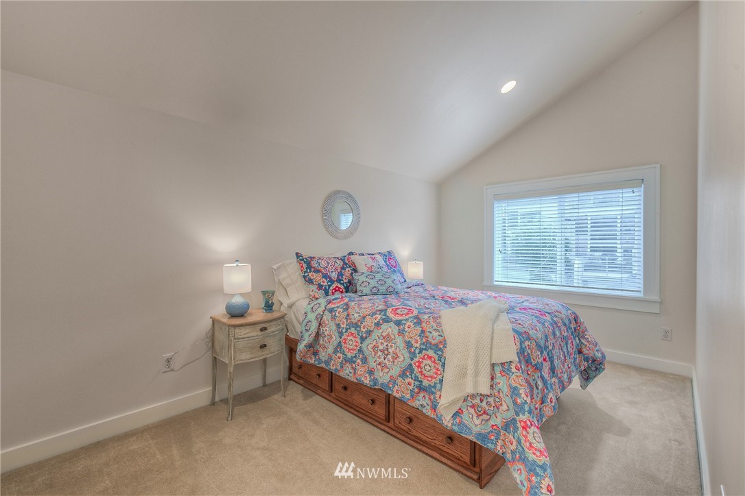 1940 9th Avenue West Seattle, WA 98119 - Photo 22 of 25 a bedroom with a bed and window