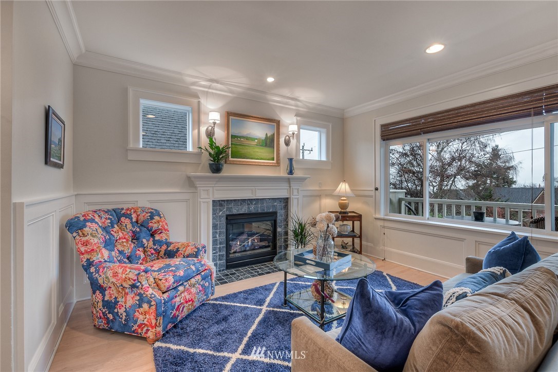 1940 9th Avenue West Seattle, WA 98119 - Photo 4 of 25 a living room with furniture fireplace and a large window