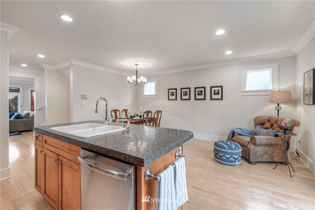 1940 9th Avenue West Seattle, WA 98119 - Photo 9 of 25 a very nice looking kitchen with a table chairs and a refrigerator