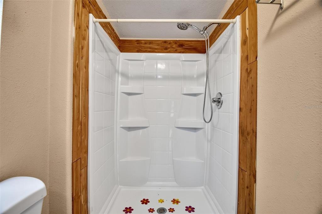 156 Kingfish Road Pomona Park, FL 32181 - Photo 23 of 55 a bathroom with a shower and a toilet