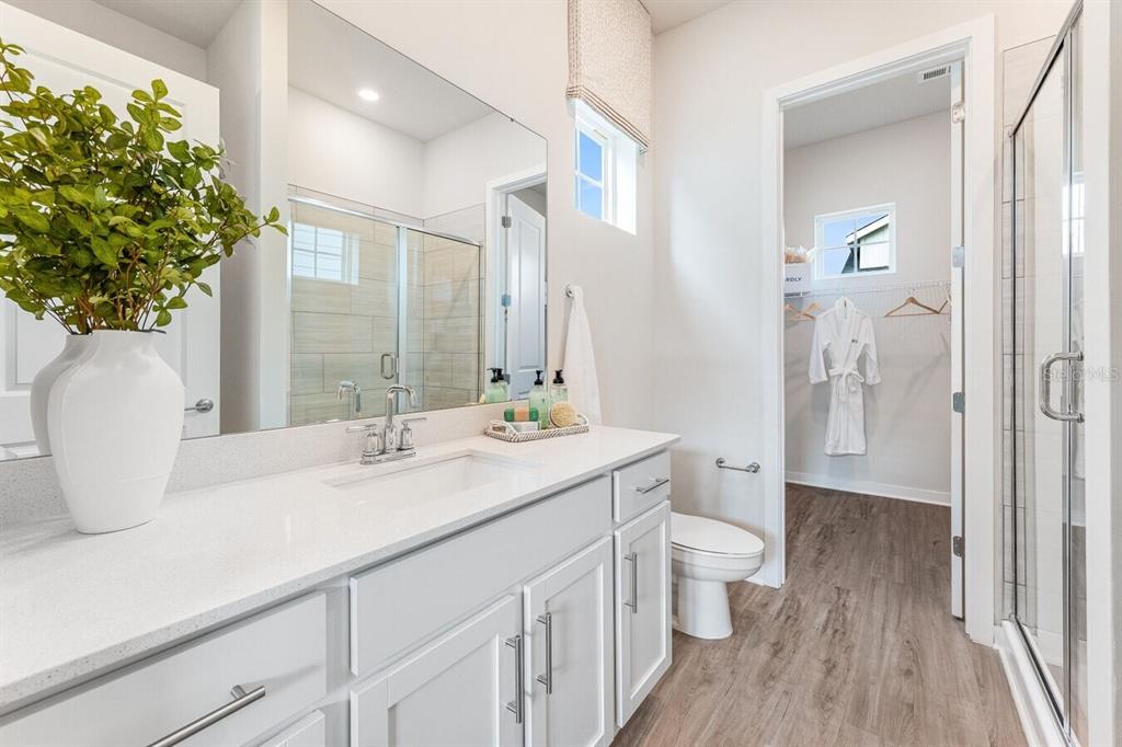 2507 Koji St Mount, Unit ELEVATE Mount Dora, FL 32757 - Photo 12 of 12 a bathroom with a sink a toilet and shower
