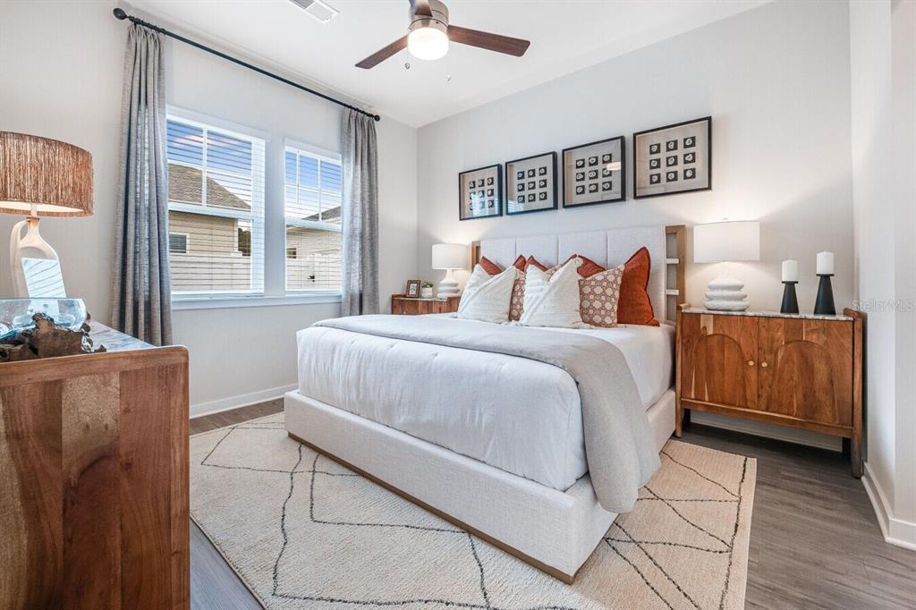 2507 Koji St Mount, Unit ELEVATE Mount Dora, FL 32757 - Photo 7 of 12 a bed room with a bed and a couch