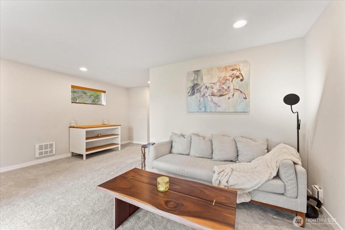 12418 2nd Place Southwest Burien, WA 98146 - Photo 27 of 39 a living room with furniture and a window