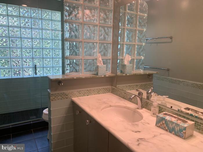 1902 Foxhall Road McLean, VA 22101 - Photo 11 of 15 a bathroom with a sink and a mirror