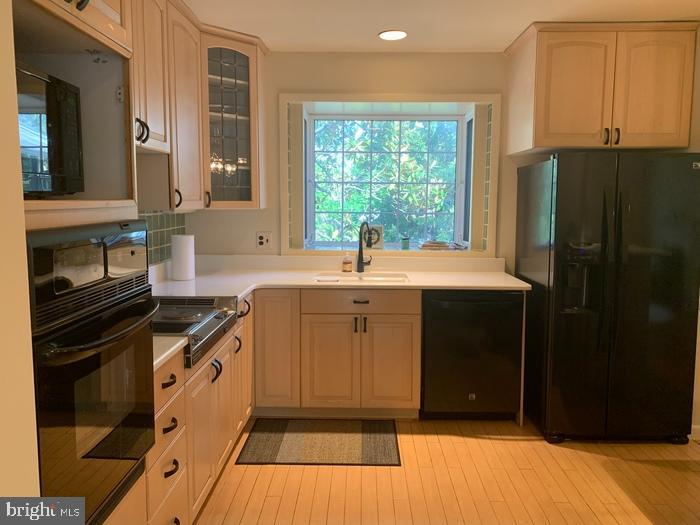 1902 Foxhall Road McLean, VA 22101 - Photo 4 of 15 a kitchen with a sink stove and refrigerator
