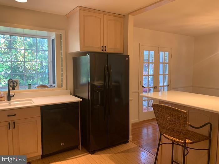 1902 Foxhall Road McLean, VA 22101 - Photo 7 of 15 a kitchen with stainless steel appliances granite countertop a refrigerator a sink a stove and island