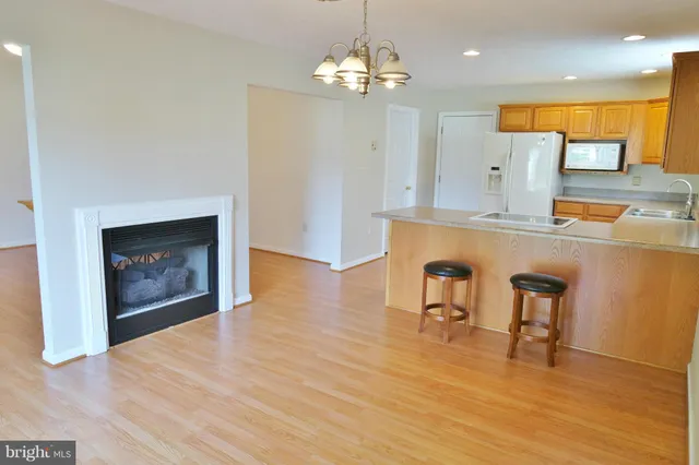 a view of a kitchen with a table and chairs