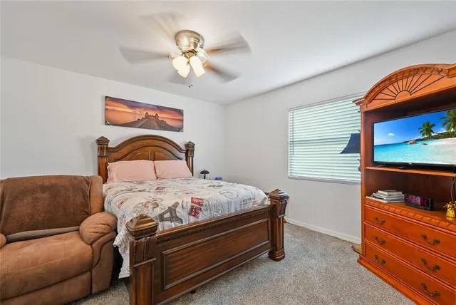 a bedroom with a bed and dresser