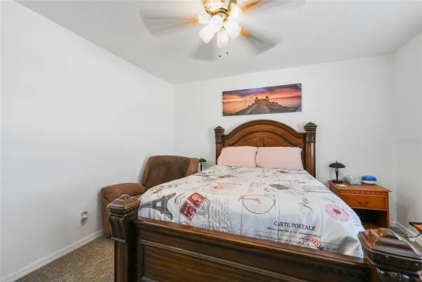a bedroom with a bed and dresser