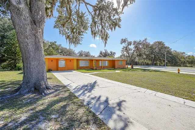 a view of swimming pool with a yard