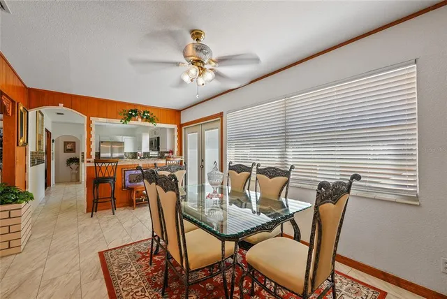 a dining room with furniture and window